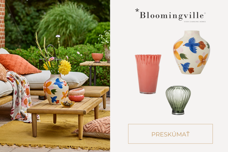 Kameninová váza Bloomingville s lúčnym kvietím na záhradnom stole pre štýlové vonkajšie stolovanie.