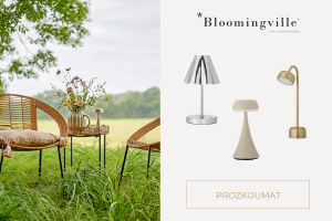 Svítící bezdrátová přenosná LED lampička Bloomingville na večerním stole vytvářející útulnou hygge atmosféru.