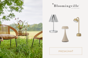 Svítící bezdrátová přenosná LED lampička Bloomingville na večerním stole vytvářející útulnou hygge atmosféru.